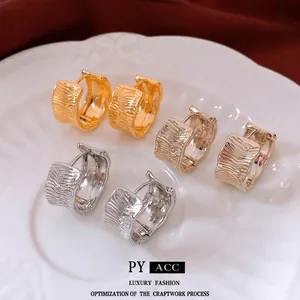 18K gold plated wide corrugated hoop earrings set in gold and silver finishes