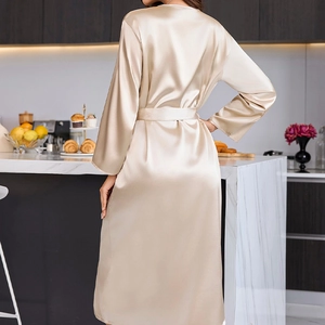 Champagne long ice silk satin bathrobe with waist belt shown in a home setting