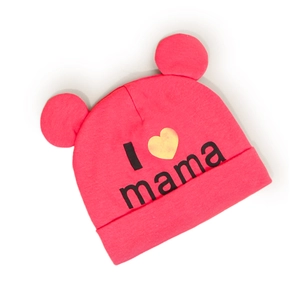 Detail of pink knitted baby beanie featuring adorable ears and I Love Mama print