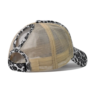 Detail of leopard print ponytail baseball hat showing mesh back and elastic cross openings