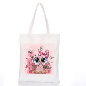 Minimalist white canvas tote bag featuring a cute pink cartoon owl print with bow tie