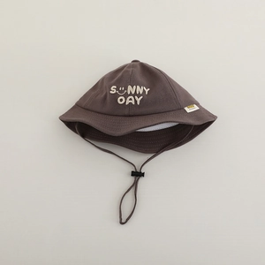 Detail of dark brown kids sun hat featuring sunny day embroidery and adjustable wind cord