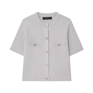 Close-up of light grey short sleeve knit cardigan featuring elegant gold embossed buttons