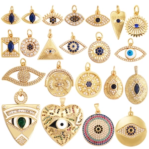 Golden Evil Eye charms collection with blue and white crystals in diverse geometric shapes