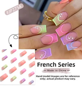 Detail of pink and purple gradient French press-on nails with white tips and star patterns