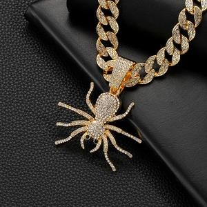 Gothic gold-plated spider pendant necklace with sparkling crystals on thick cuban chain