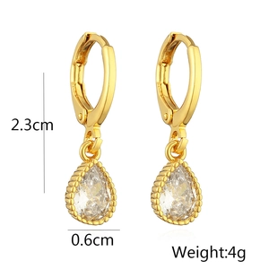 Detail showing 2.3cm length and 4g weight of gold drop earrings with zircon crystals