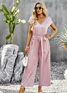 Detailed view of pink V-neck short sleeve jumpsuit with waist belt and wide legs