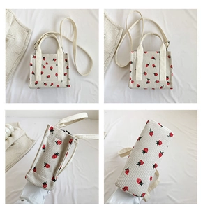 Detailed four-way view of a beige corduroy tote bag featuring a cute red strawberry pattern