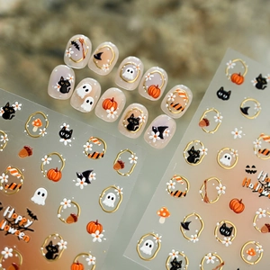Halloween nail stickers with cute pumpkin, ghost, and black cat designs and gold borders