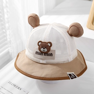 Detailed macro view of the breathable mesh crown and cute bear ears on the baby sun hat