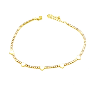 Detail of gold tennis anklet with sparkling zircons and five white heart pendants