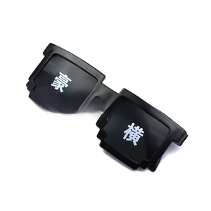 Close-up of black pixelated mosaic sunglasses with bold white character printing