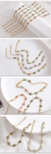 Detail of adjustable heart-shaped evil eye bracelet in colorful enamel and gold finish