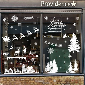 White Christmas window decals featuring reindeer, snowflakes, and festive trees set
