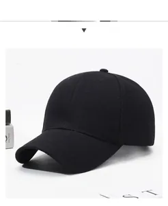 Detailed view of black cotton baseball cap with six-panel crown and curved brim detail