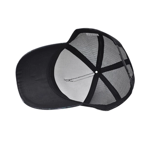 Detail of baseball cap interior showing black mesh back and white cotton lining