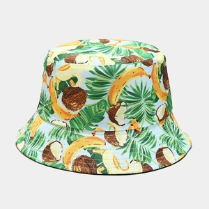 Detail of tropical banana and coconut print on light blue bucket hat fabric