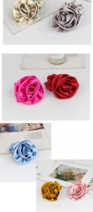 Detailed view of colorful satin rose hair scrunchies with elegant 3D petal design