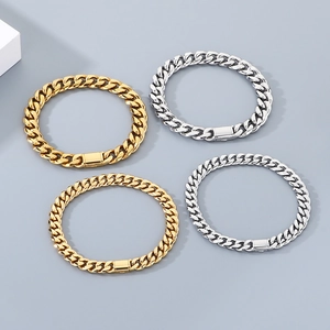 Detailed view of gold and silver stainless steel Cuban link bracelets with flip clasps