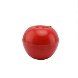 Red apple-shaped plastic food storage container for fruits and vegetables on white background