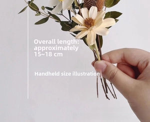 Macro detail of handmade dried daisy bouquet showing natural texture and 18cm size
