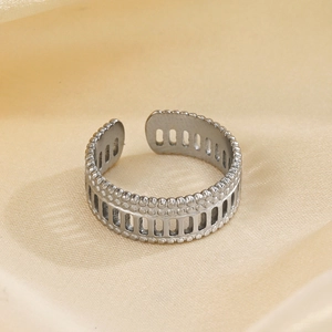 Silver Roman open ring in stainless steel featuring geometric hollow cutouts and dots