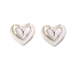 Minimalist silver heart stud earrings with double layered polished metal design