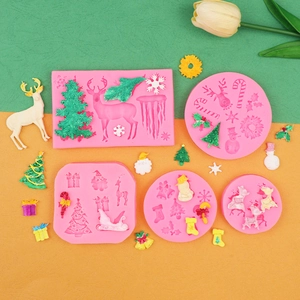 Detailed view of 5 pink silicone Christmas molds for DIY fondant and resin crafts