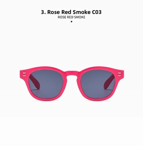 Detail view of oval rose red sunglasses with gray lenses and double metal rivets