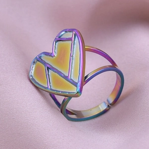 Detailed macro view of an adjustable rainbow PVD plated geometric heart ring for women