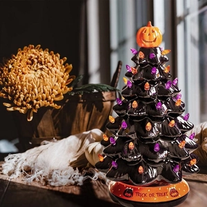 Ceramic Halloween tree decor with orange pumpkin topper and Trick or Treat base