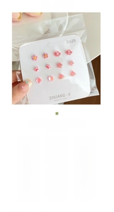 Close-up of 6 pairs of S925 silver needle floral earrings in pink and peach tones