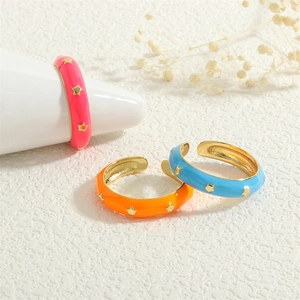 Colorful enamel star rings in pink, orange and blue with 18K gold plated finish