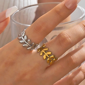 Polished stainless steel leaf rings in gold and silver finish for a nature-inspired style