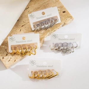 Minimalist stainless steel earring set featuring gold and silver geometric hoop designs