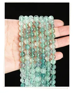 Macro detail of natural green fluorite beads showing translucent texture and organic patterns