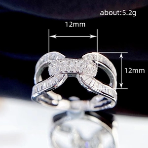 U-shaped interlocking bow ring with cubic zirconia in silver-tone metal finish