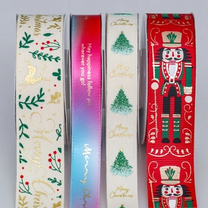 Detail of Christmas ribbons with nutcracker, reindeer and Merry Christmas patterns