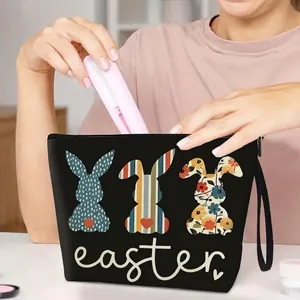 Easter bunny cosmetic bag in black canvas featuring cute rabbit prints and zipper closure