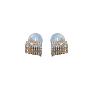Elegant gold geometric earrings with pavé crystals and large white pearl accents