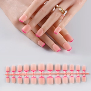 French manicure set featuring nude pink square nails with sparkly pink tips on display