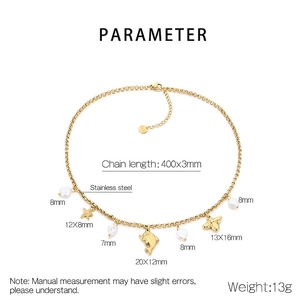 Detailed view of gold stainless steel necklace with starfish, dolphin and pearl charms