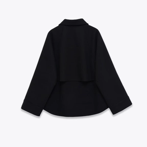 Back view of a minimalist black wool blend cropped jacket for women featuring a sleek zipper