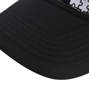Detailed close-up of high-quality five-row stitching on a black mesh baseball cap brim