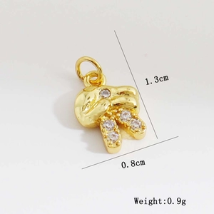 Detail of bunny charm showing size 1.3cm by 0.8cm and 0.9g weight for DIY jewelry