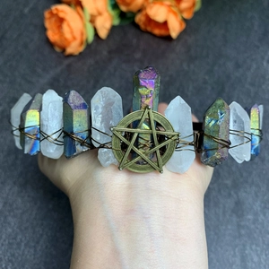 Detail of handmade crystal star tiara with raw colorful stones and bronze wire wrap