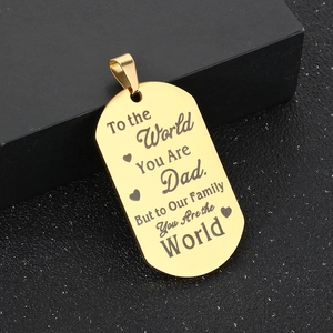 Detail of gold titanium steel tag necklace with To the World You Are Dad engraving