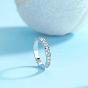 Macro detail of silver pavé eternity ring featuring polished metal and micro-set crystals