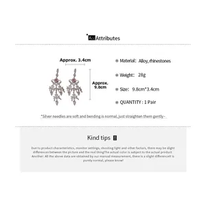 Detailed specs of tassel heart earrings with silver needles and crystal rhinestones